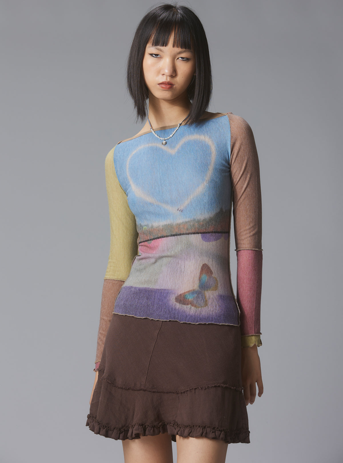 Skye Top Y2K allover-print mesh top with custom artwork - UNIF Sale