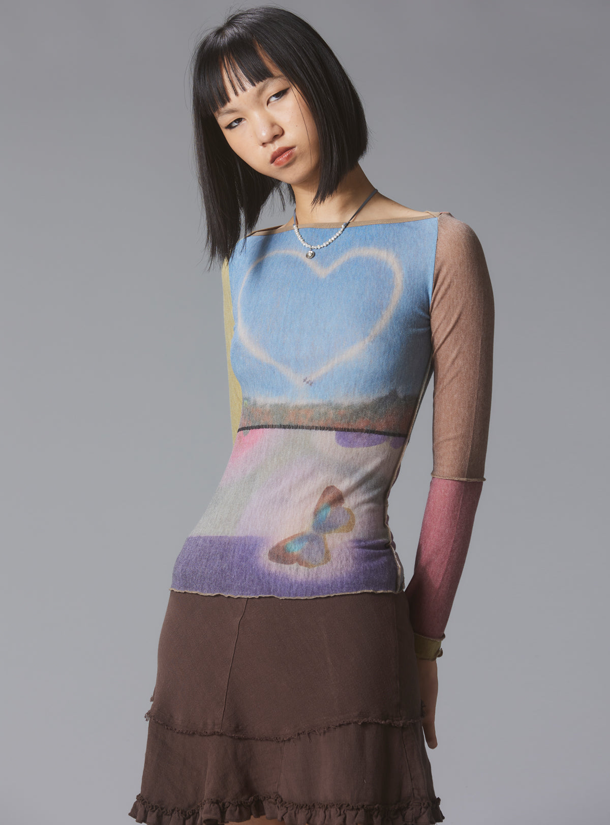 Skye Top Y2K allover-print mesh top with custom artwork - UNIF Sale